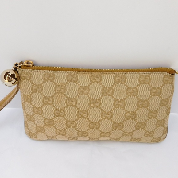 Gucci Handbags - AUTHENTIC GUCCI GOLD CANVAS WRISTLET FOB CHARM